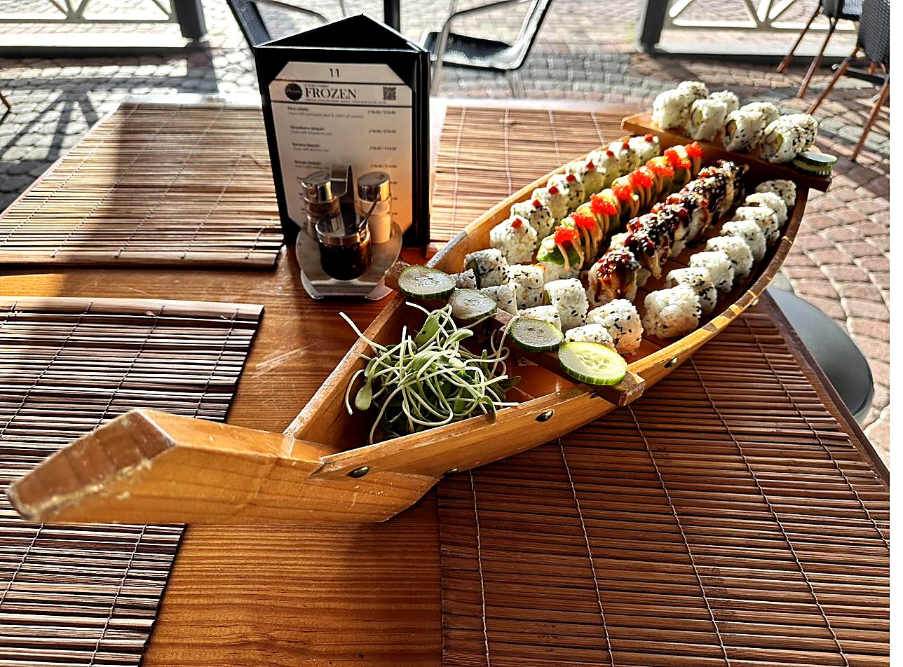 Dragon roll — tempura shrimp and cucumber topped with avocado, spicy mayo and tobiko