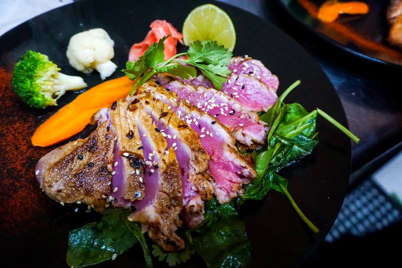 Seared tuna steak — 8oz sesame-coated tuna with ginger and wasabi