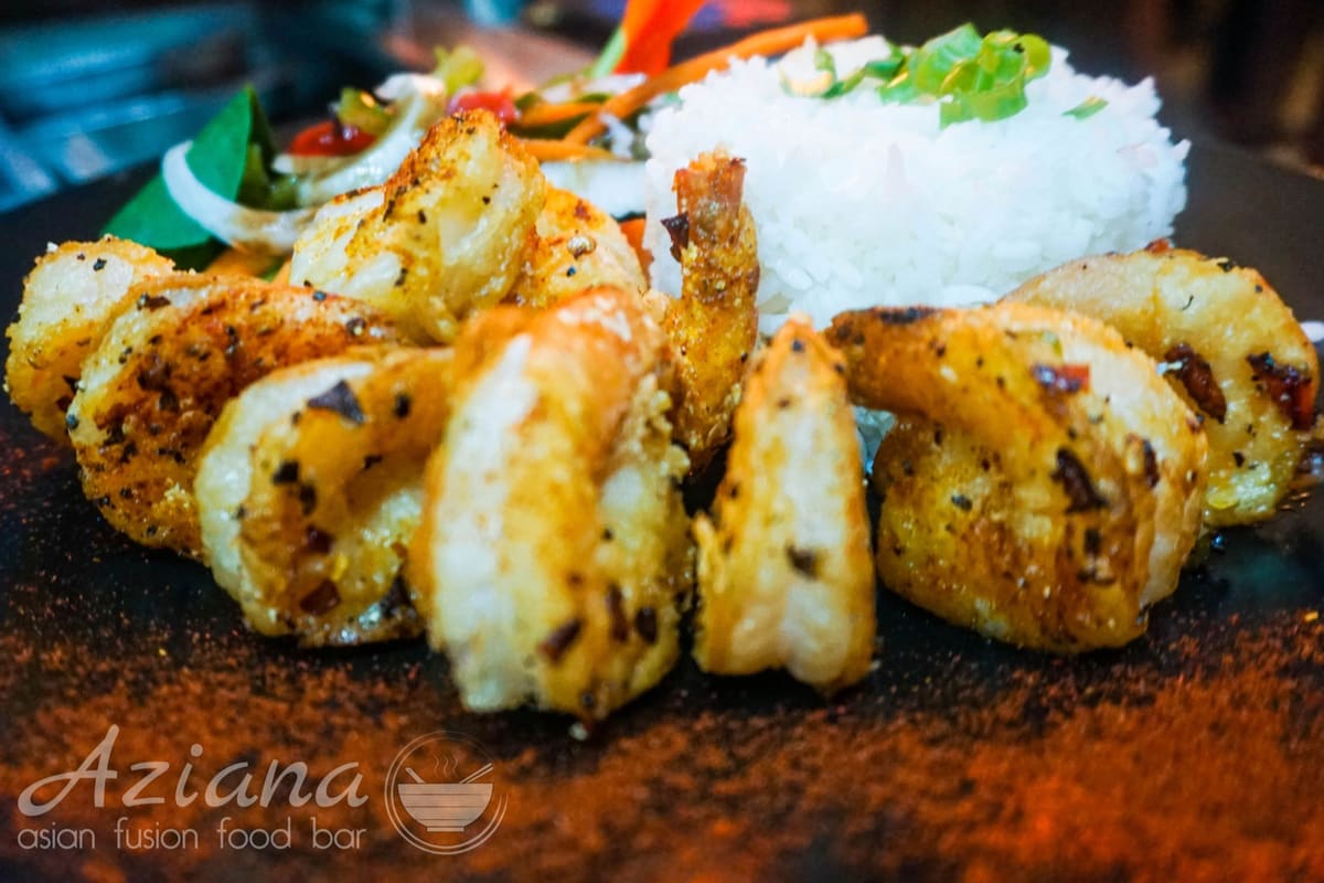 Salt and pepper shrimp served with rice and vegetables at Aziana