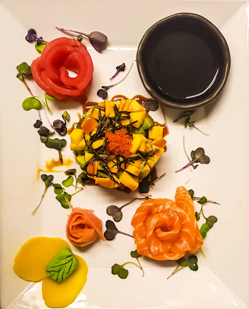 Tuna sushi stack with avocado, mango and sashimi roses